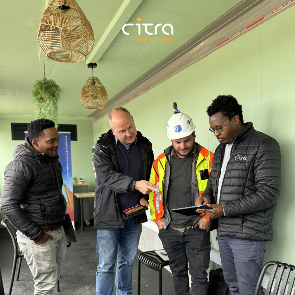 Open Space Trainer, Citra Site Manager, Citra Head of Construction and Citra Computational Architect looking at the Open Space App on an iPad during the Open Space Training.