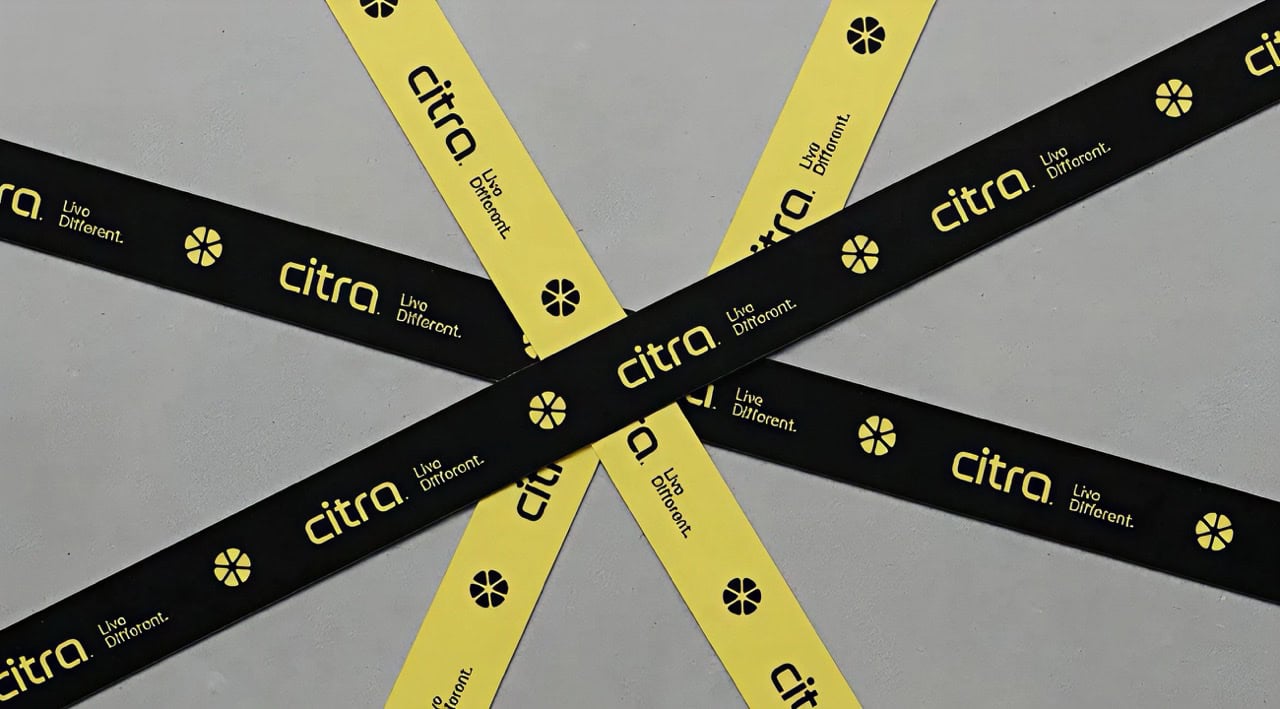 Citra branded lanyards with black and yellow design, showcasing the company's logo and slogan.