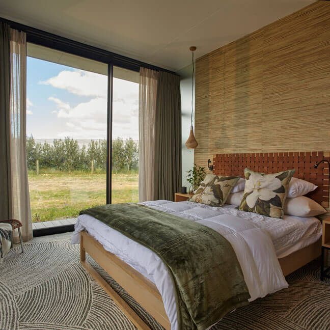 ePod Bright bedroom with large window and scenic outdoor view.