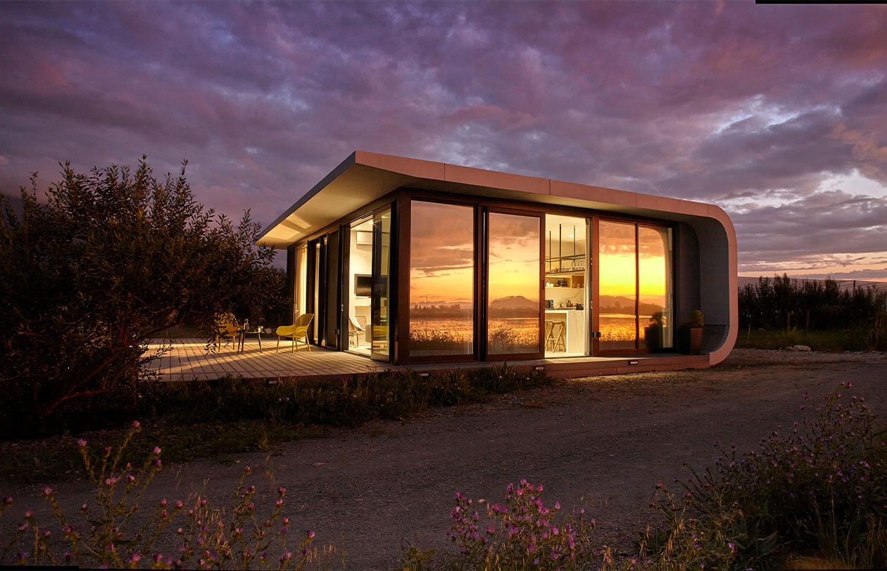 ePod Contemporary modern house with large glass windows at sunset, scenic landscape view, minimalist desi.