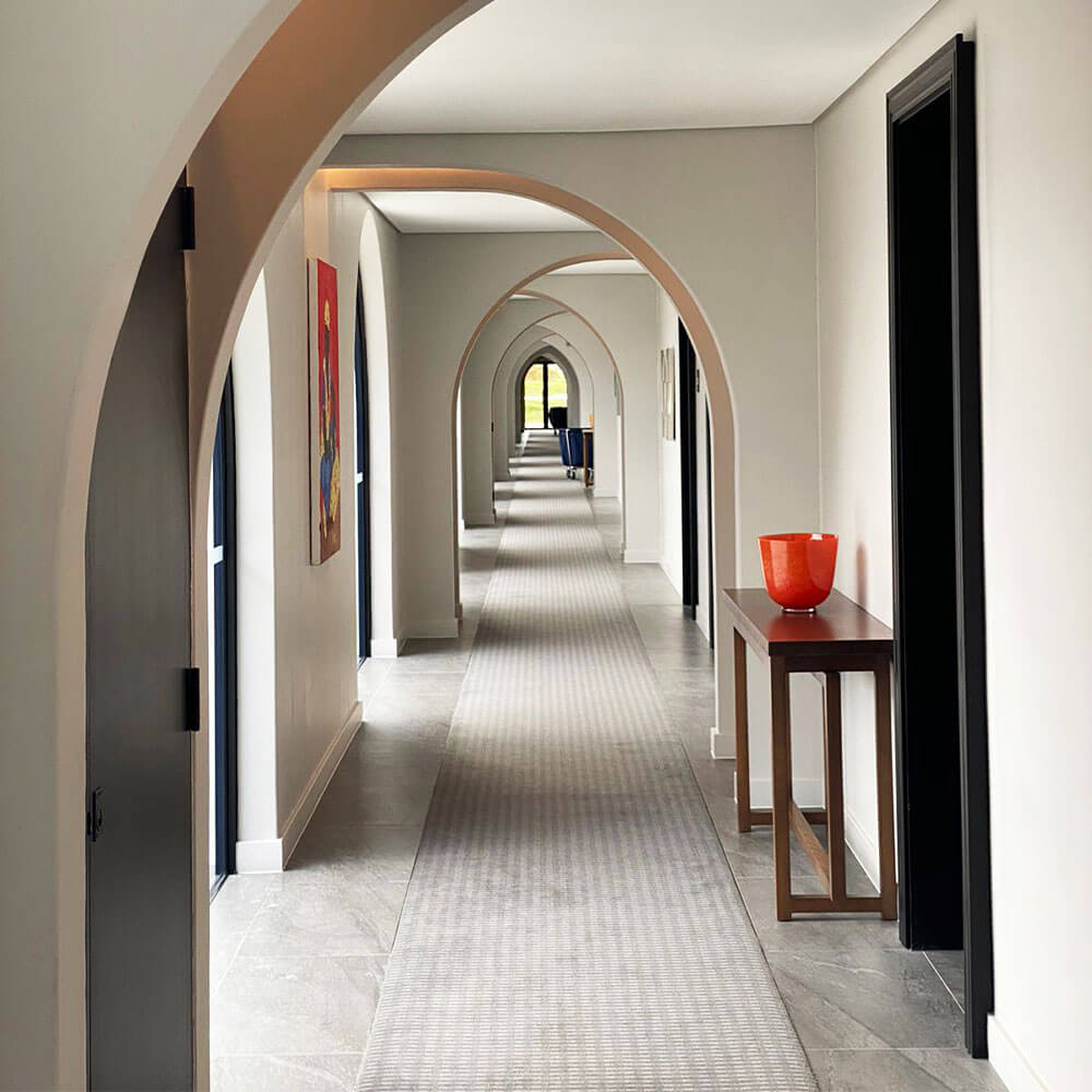 Contemporary interior hallway with arches and minimalist decor at Citra.